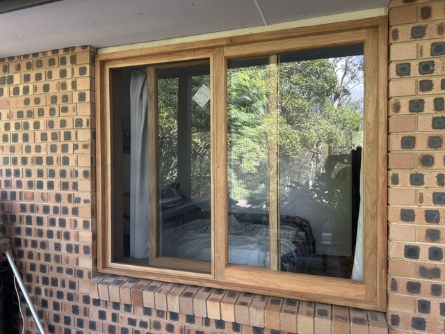Bifold doors on a Sunshine Coast home after hardware repair and adjustment