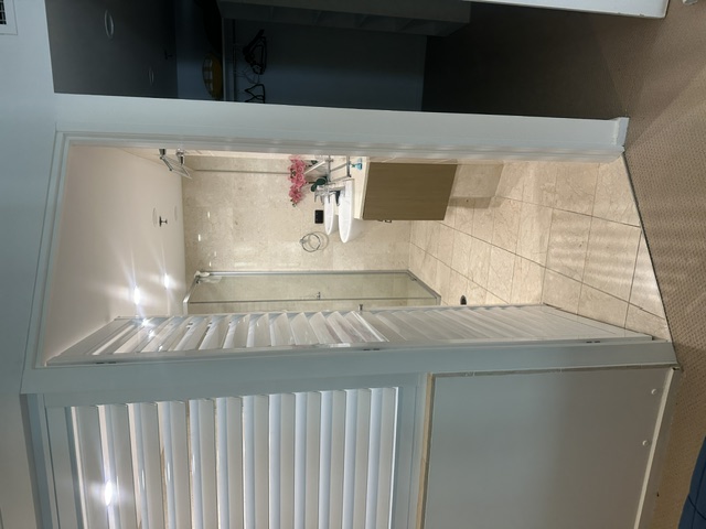 Roller blinds and shutters installed in a living area