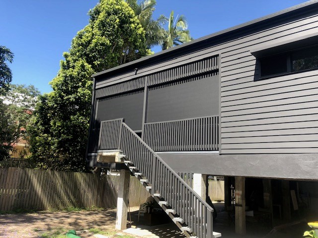 Large screens fitted to the elevated deck of a Queenslander home